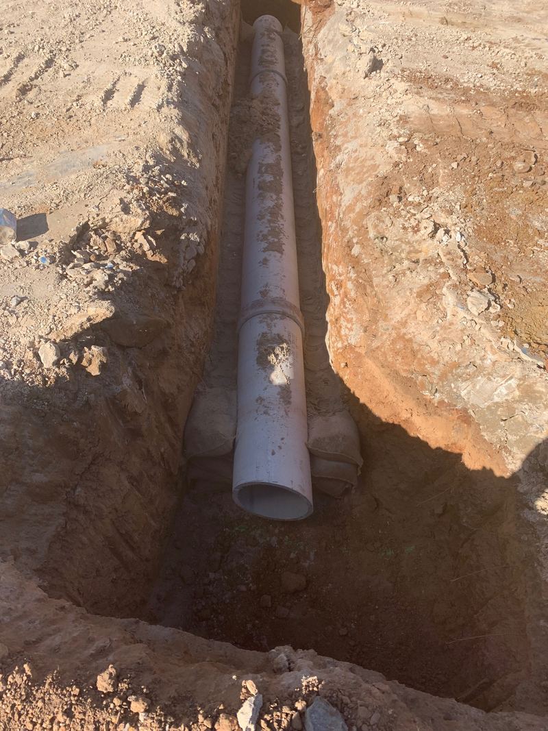 RCP stormwater pipe laid on bedding in a deep trench