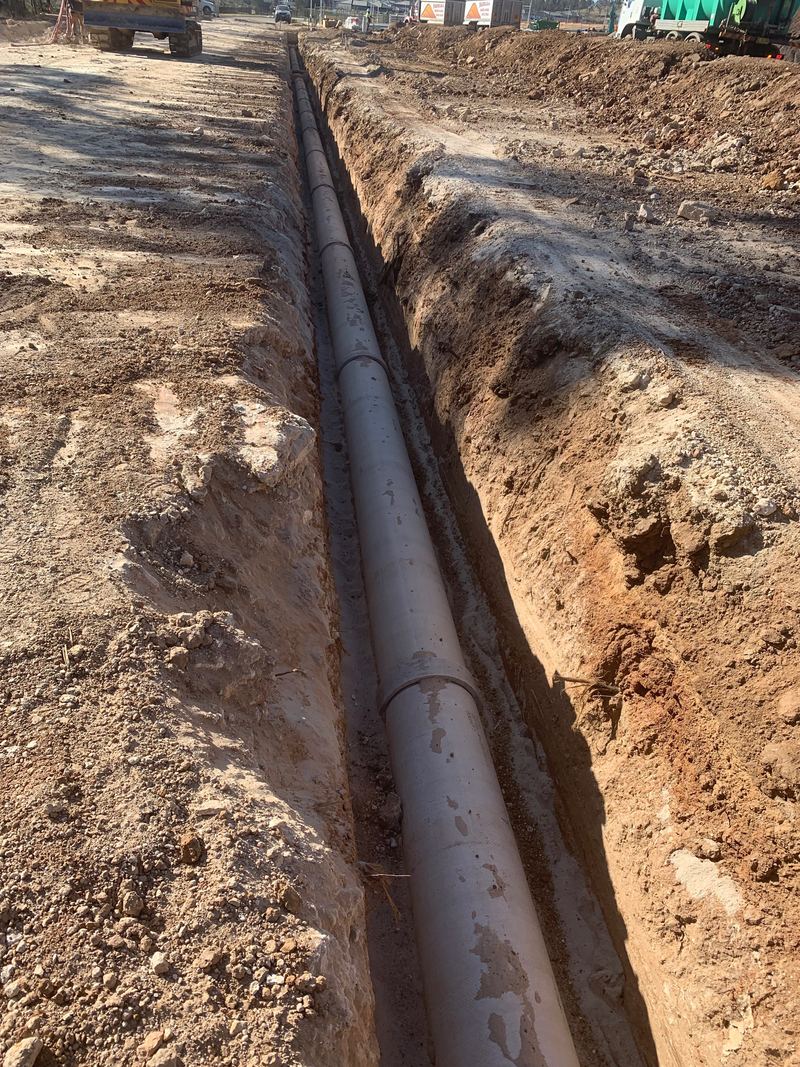 Long straight trench with stormwater pipe laid to grade