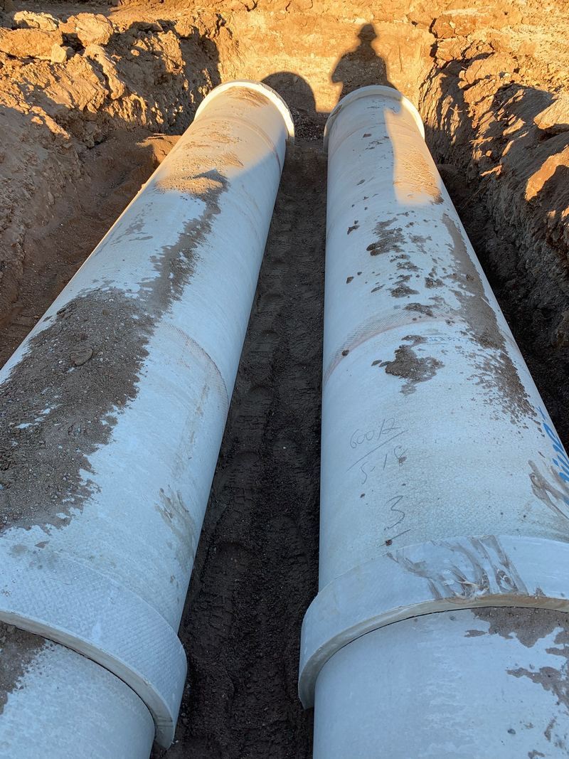 Twin RCP stormwater pipes laid side by side in a trench by Douglass Civil, south-west Sydney